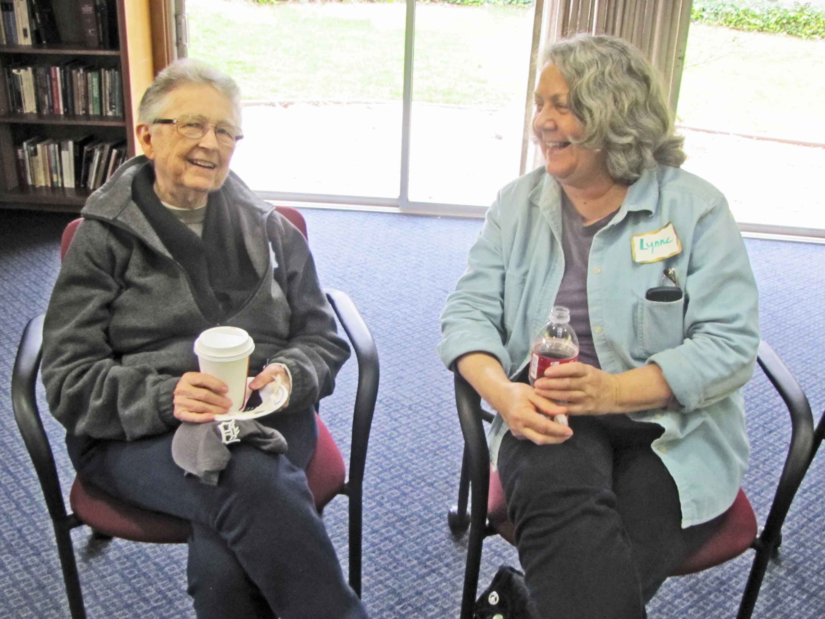 Jackie Hudson (left) talking with friend Lynn Greenwald during the Pacific Life Community gathering in March.